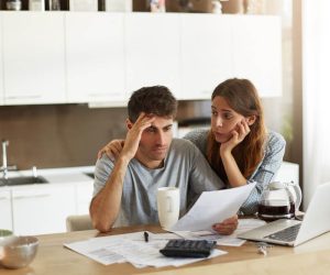 young-couple-checking-their-family-budget (1)